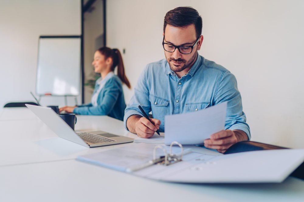 Businessman doing paperwork in the office
