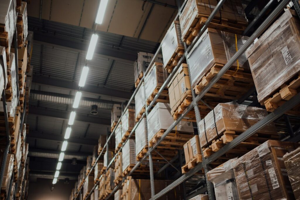 Racked boxes in a warehouse, representing a controlled aerospace supply chain under AS9100