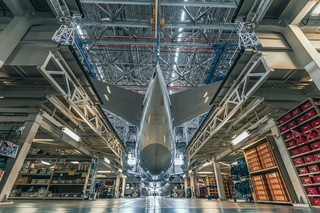 Commercial jet aircraft inside a maintenance hangar