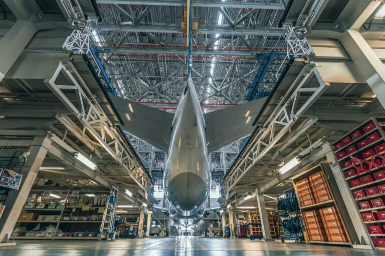 Commercial jet aircraft inside a maintenance hangar