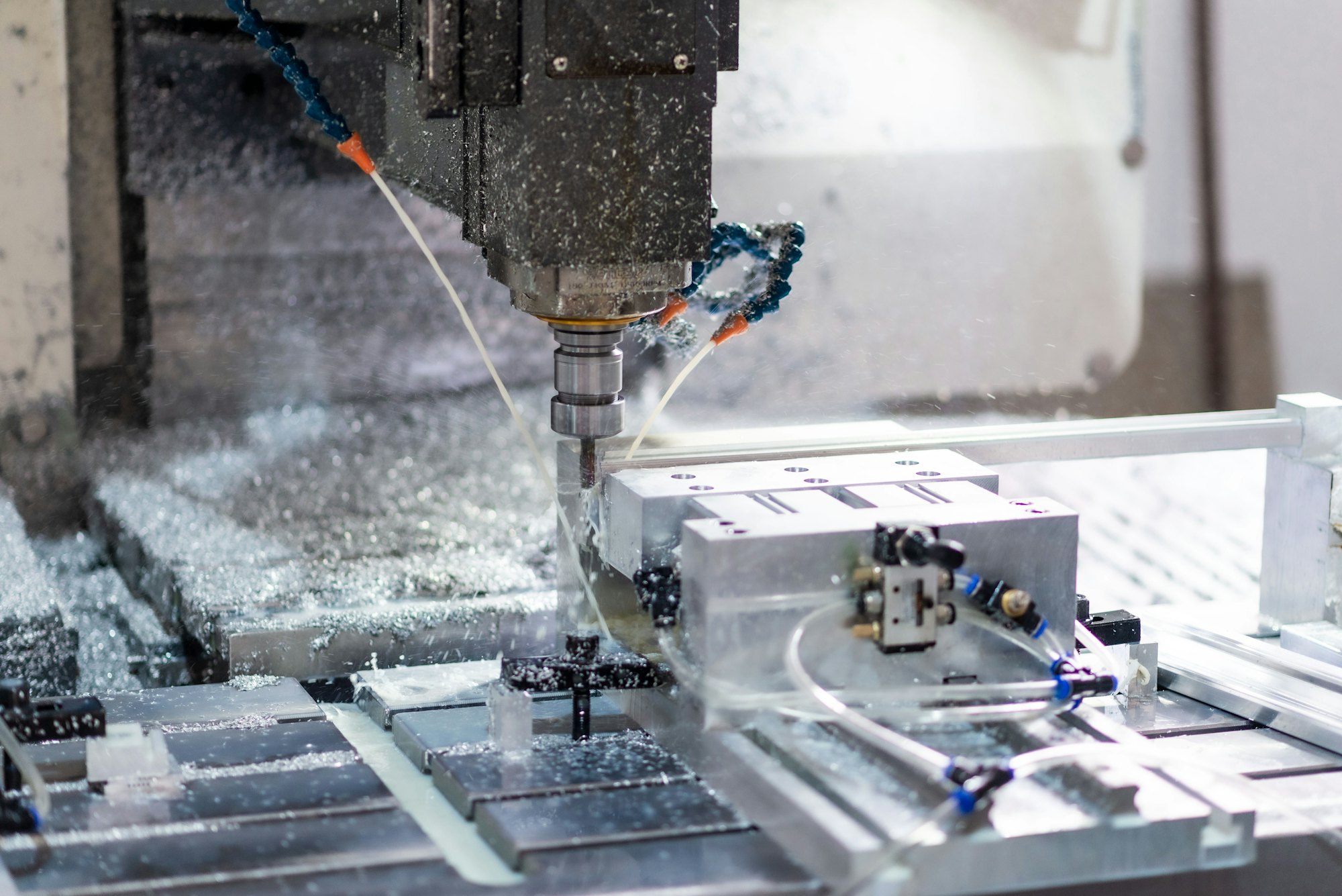 CNC milling machine cutting precision aluminium parts