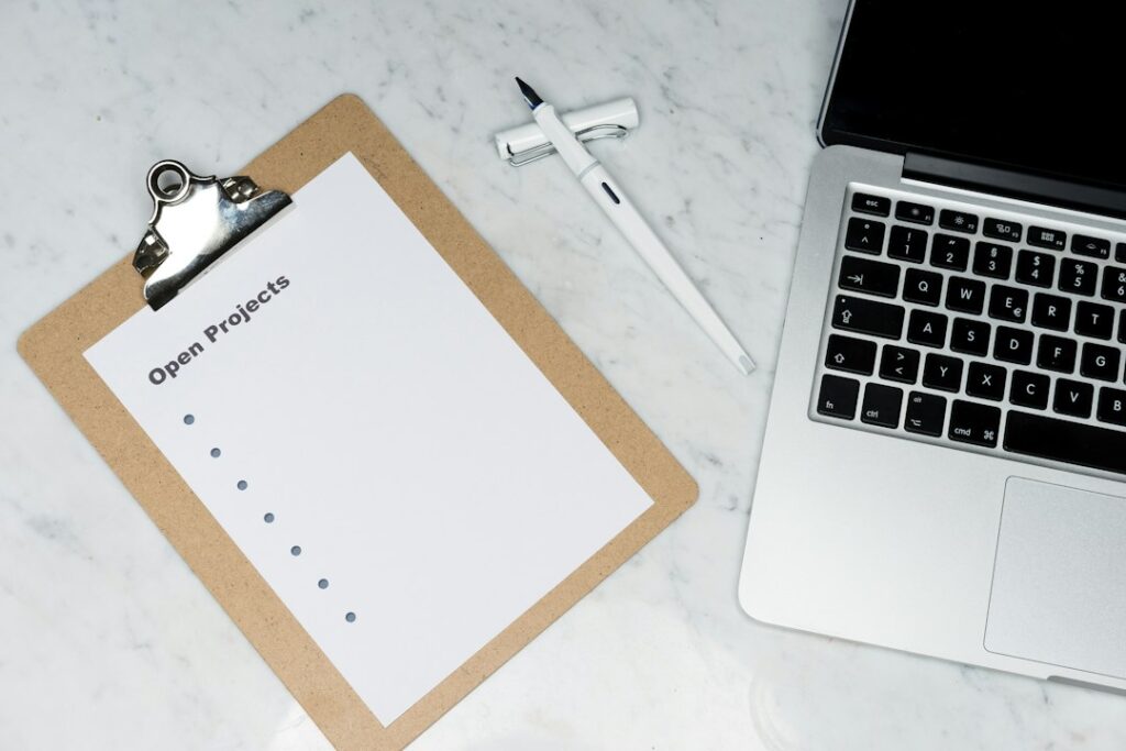 Checklist on paper with a pen, representing planning the transition to ISO 9001:2026